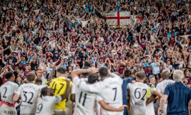 West Ham players celebrate in front of their fans after winning the Europa Conference League final.