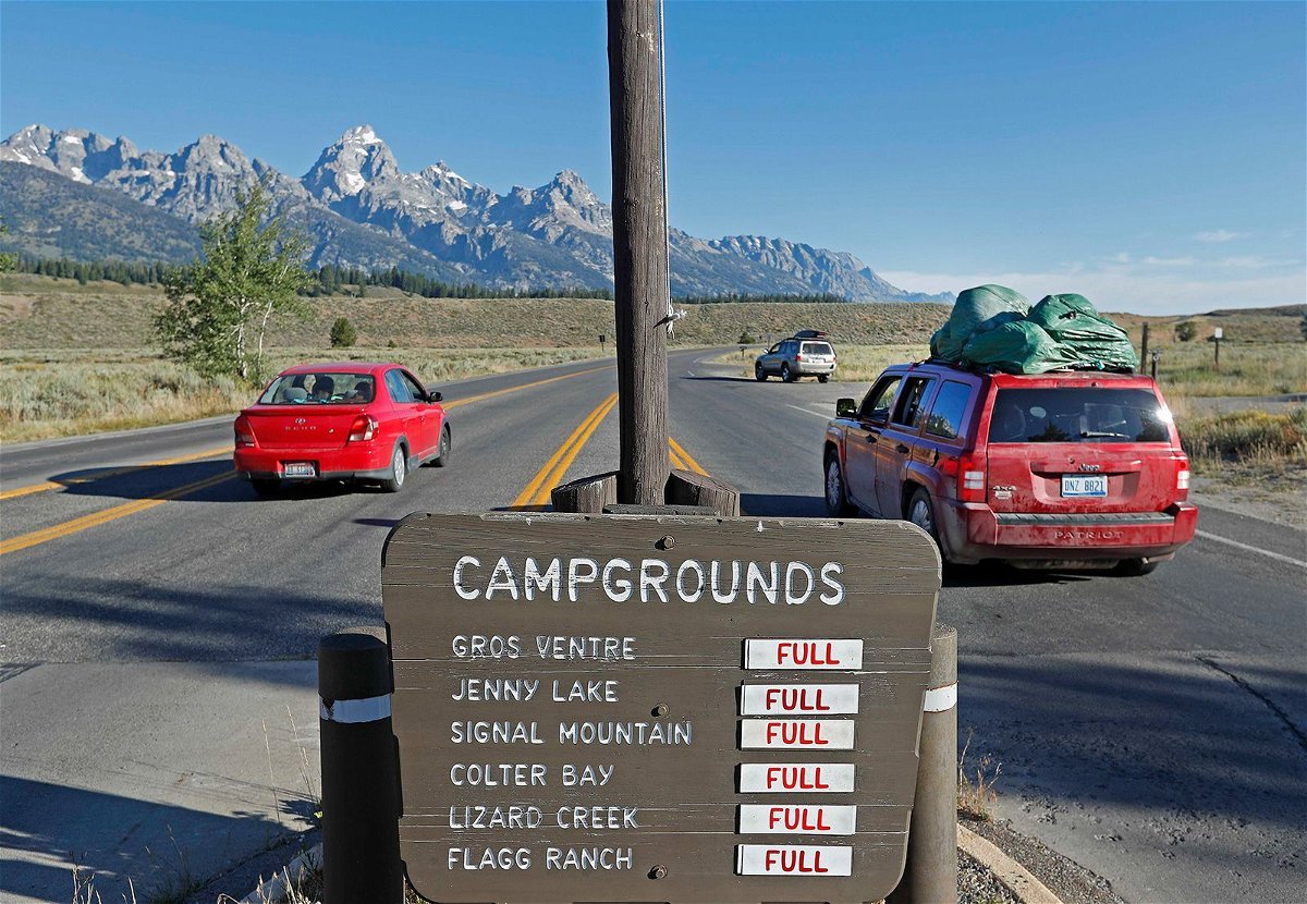 <i>George Frey/Getty Images</i><br/>Signs show full campgrounds in Grand Teton National Park on August 19