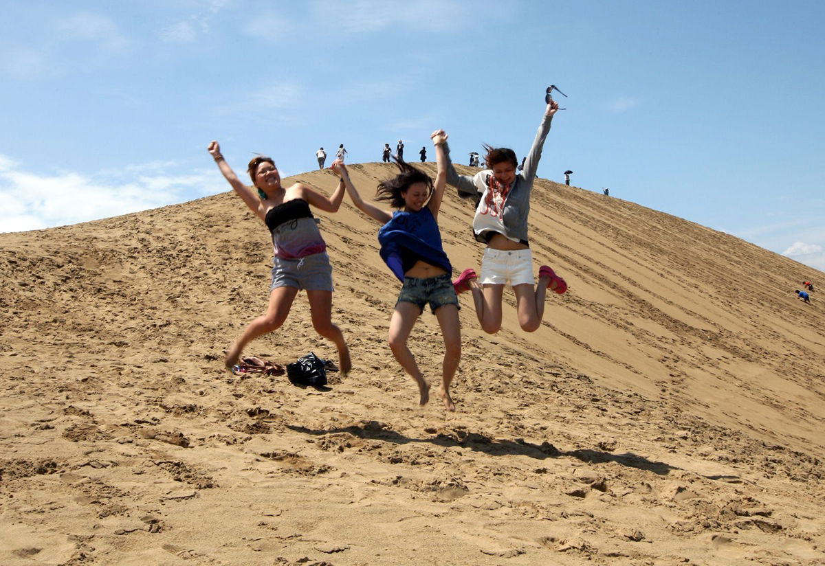 <i>Buddhika Weerasinghe/Getty Images</i><br/>Japanese women prance on Tottori sand dunes in 2012 in Tottori