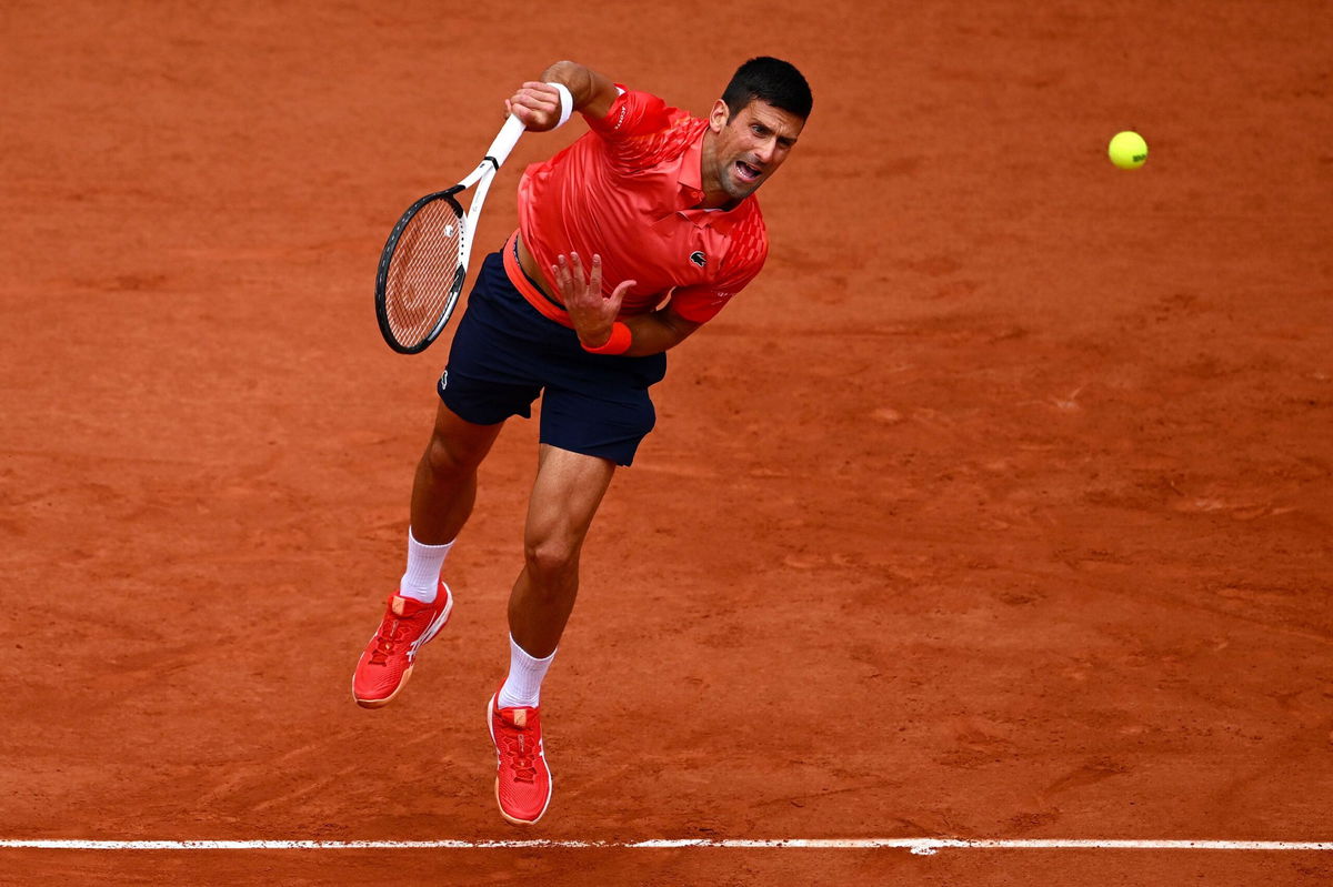 <i>Clive Mason/Getty Images</i><br/>Djokovic hits a serve against Casper Ruud in the French Open final on Sunday