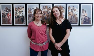 Jann Haworth and Liberty Blake with a print of a 2016 mural they made at Gazelli Art House Gallery in London in June 2023.