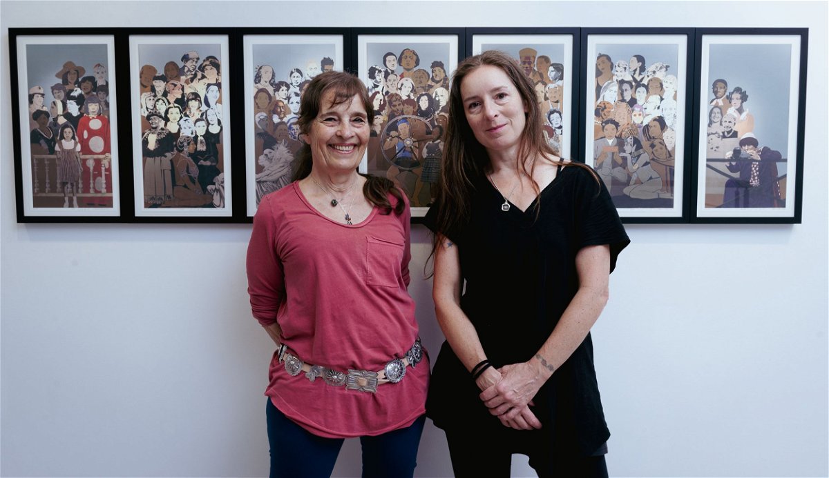 <i>Toby Hancock/CNN</i><br/>Jann Haworth and Liberty Blake with a print of a 2016 mural they made at Gazelli Art House Gallery in London in June 2023.