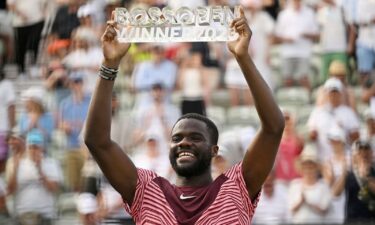 Frances Tiafoe celebrates with the trophy after winning the Stuttgart Open on Sunday.