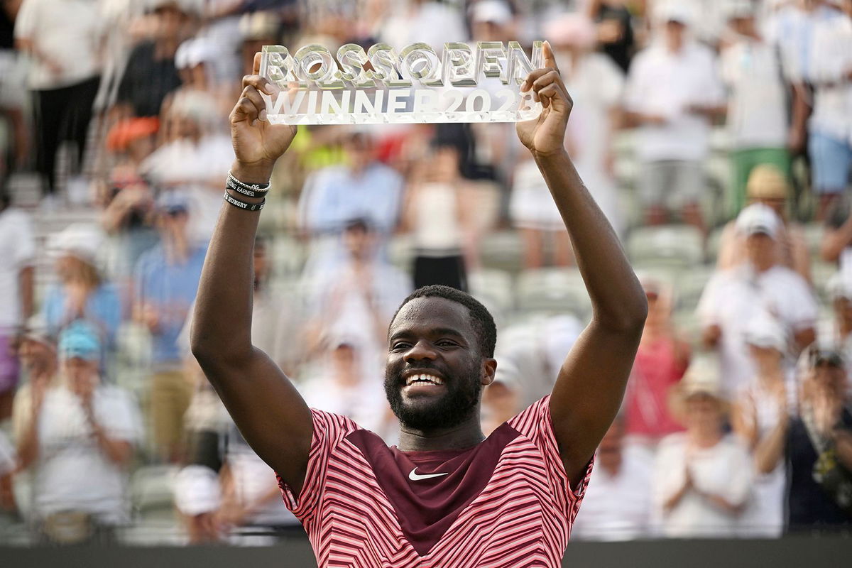 <i>Marijan Murat/AP</i><br/>Frances Tiafoe celebrates with the trophy after winning the Stuttgart Open on Sunday.