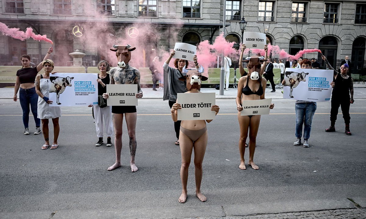 <i>Britta Pedersen/picture alliance/Getty Images</i><br/>Demonstrators of the animal rights organization PETA hold signs with the inscription 