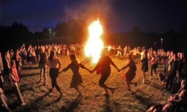 People take part in a traditional Rasos midsummer celebration