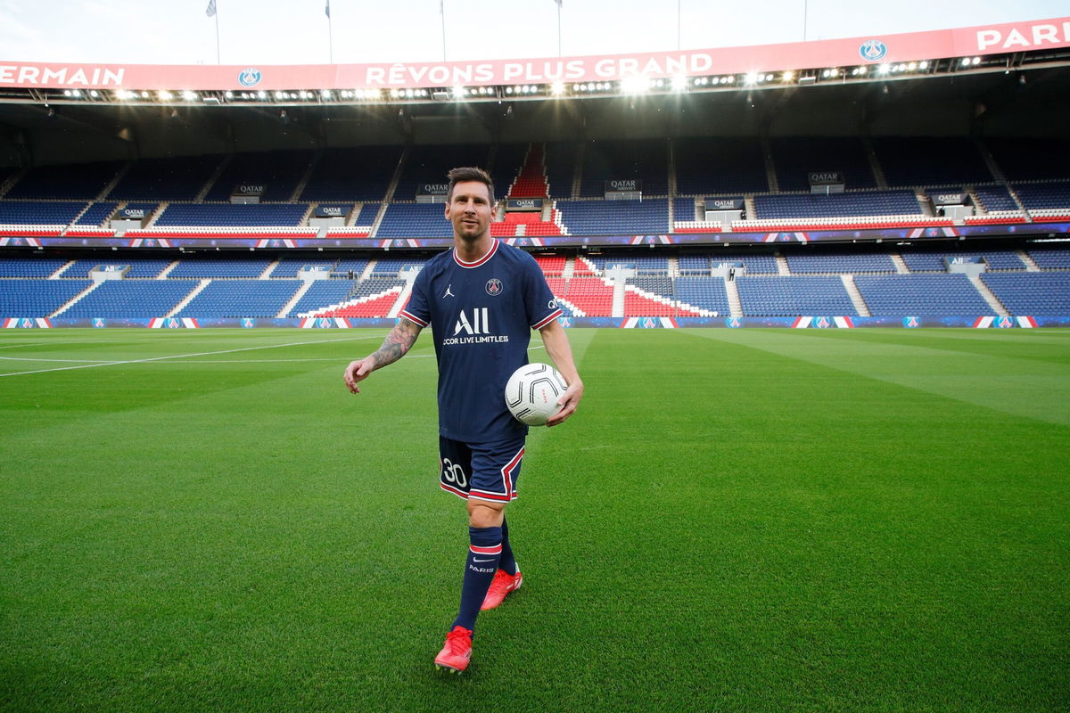 <i>Paris Saint-Germain Football/Getty Images</i><br/>Messi is unveiled at PSG's Parc des Princes in August 2021.