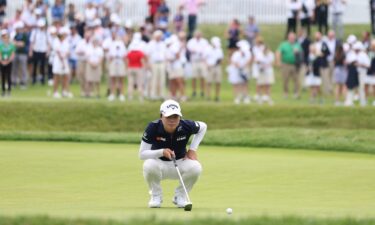 Saso lines up her putt on the 18th green.