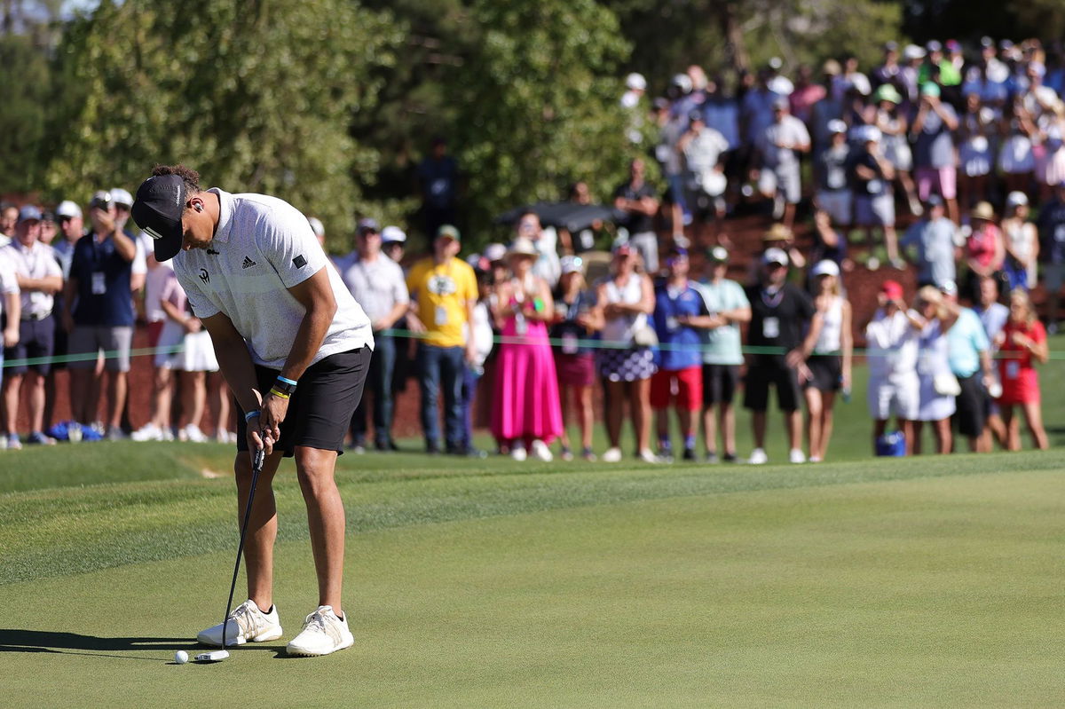 <i>Carmen Mandato/Getty Images</i><br/>Mahomes putts during The Match in 2022.