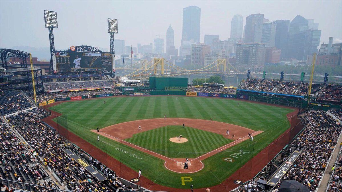 <i>Gene J. Puskar/AP</i><br/>Haze from Canadian wildfires hangs over downtown Pittsburgh and PNC Park during the game.
