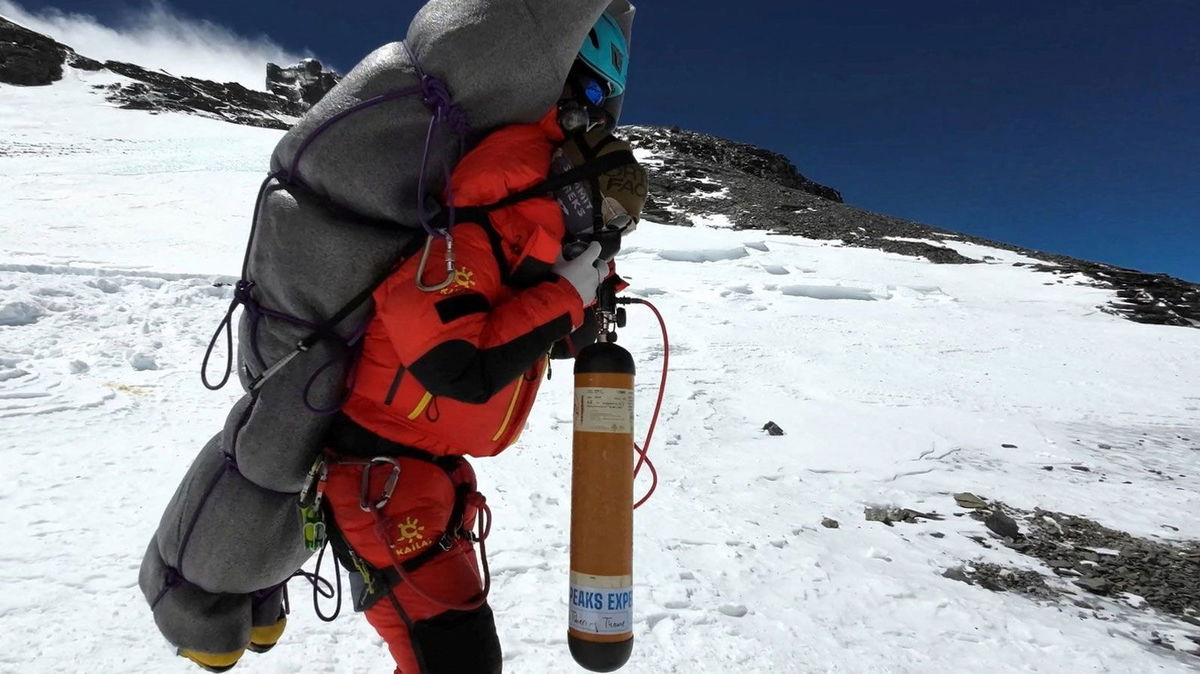 <i>Gelje Sherpa/Handout/Reuters</i><br/>Ngima Tashi Sherpa carries a Malaysian climber from the death zone at Mount Everest on May 18.