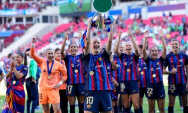 Barcelona celebrate with the trophy.