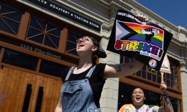 Starbucks workers attend a rally as part of a collective action over a Pride decor dispute