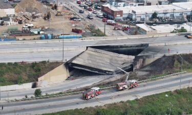A view of the aftermath of the collapse of a part of I-95 highway after a fuel tanker exploded beneath it