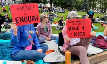 Protesters gather in Denver to call for strict gun laws.