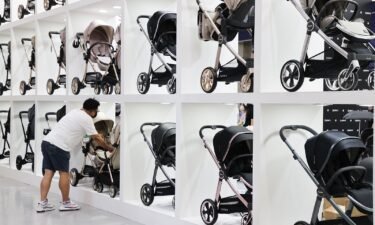 A man looks at strollers at a baby fair in Seoul