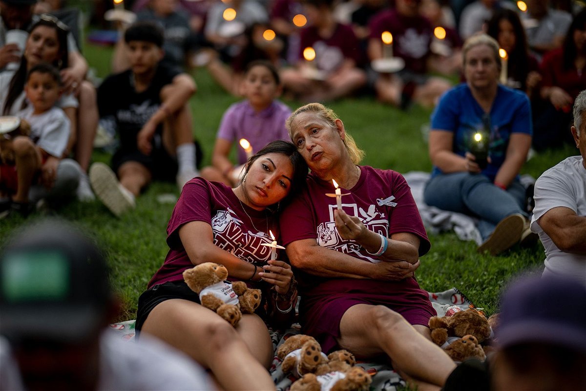 <i>Brandon Bell/Getty Images/File</i><br/>Families participate in a candlelight vigil in Uvalde dedicated to the victims on May 24