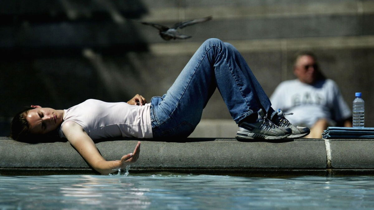 <i>Ian Waldie/Getty Images</i><br/>A girl cools off in July 2003 near a fountain in Trafalgar Square in London as a scorching heat wave hits Europe.