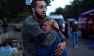 People comfort each other at the site of a Russian missile strike in Kramatorsk on June 27.