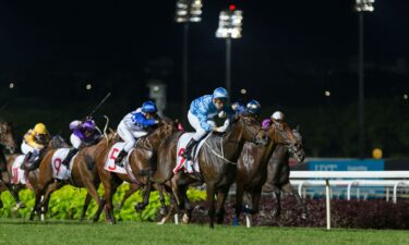 Jockeys sprint at Kranji Racecourse on May 25