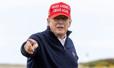 Trump gestures during a round of golf at his Turnberry course on May 2