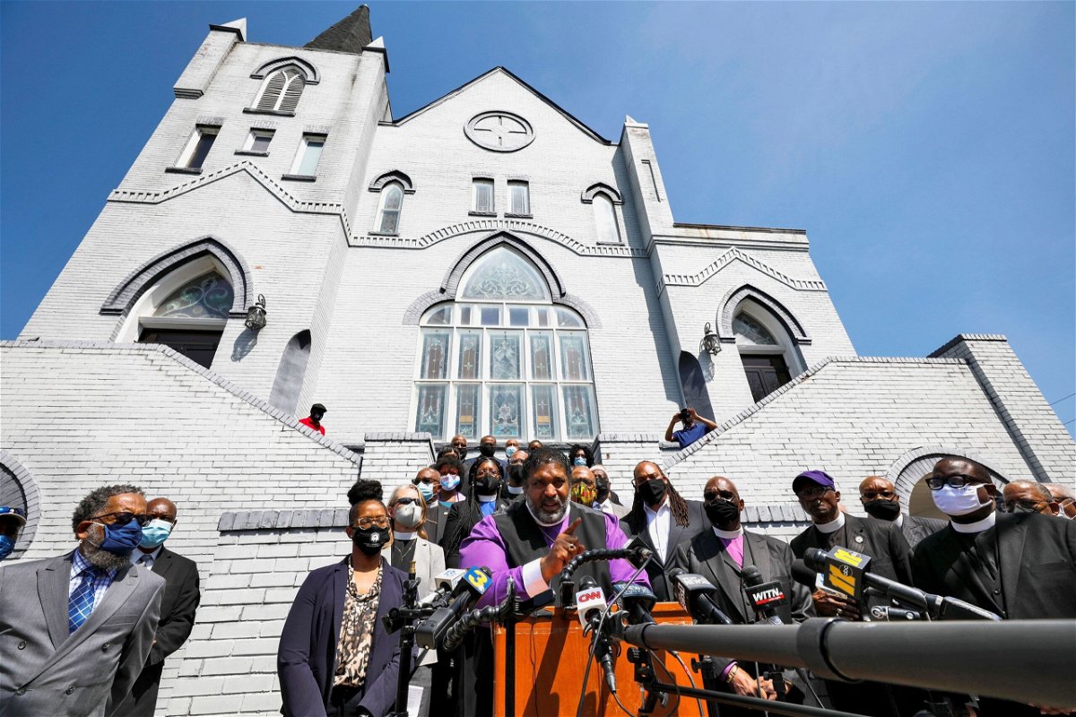 <i>Jonathan Drake/Reuters</i><br/>Bishop William J. Barber II speaks to the media after a meeting of state and local clergy at the Mount Lebanon AME Zion Church in April 2021