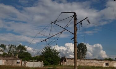 An electricity pylon and power lines in Kupiansk