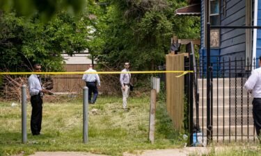 Chicago police detectives canvass the scene on Sunday.