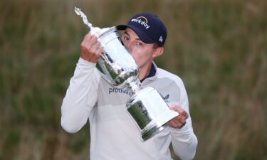 Fitzpatrick kisses the US Open trophy after victory in 2022.