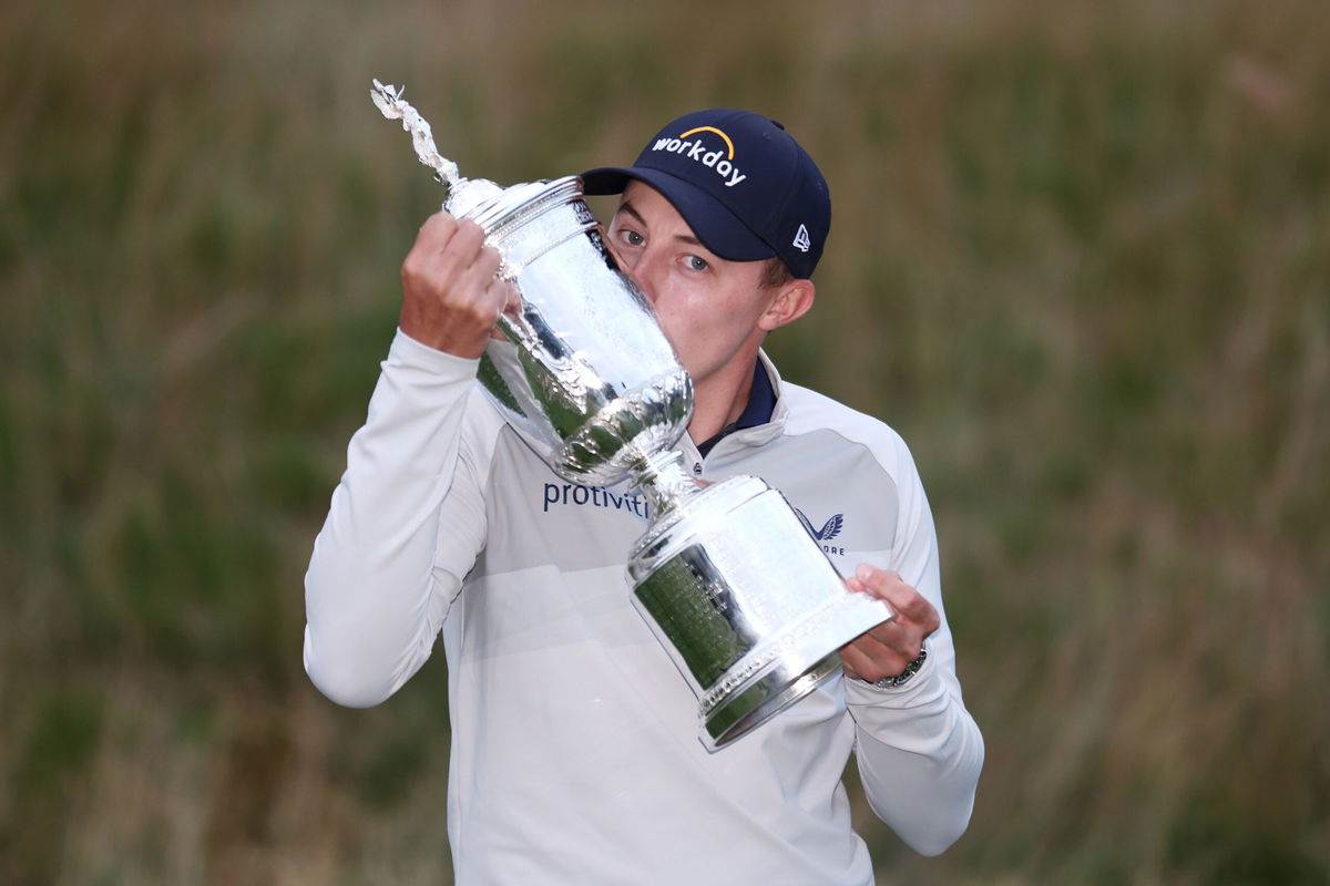 <i>Warren Little/Getty Images</i><br/>Fitzpatrick kisses the US Open trophy after victory in 2022.