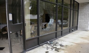 A photo exhibit entered into evidence in the trial showed bullet holes shattered the glass windows of the synagogue.