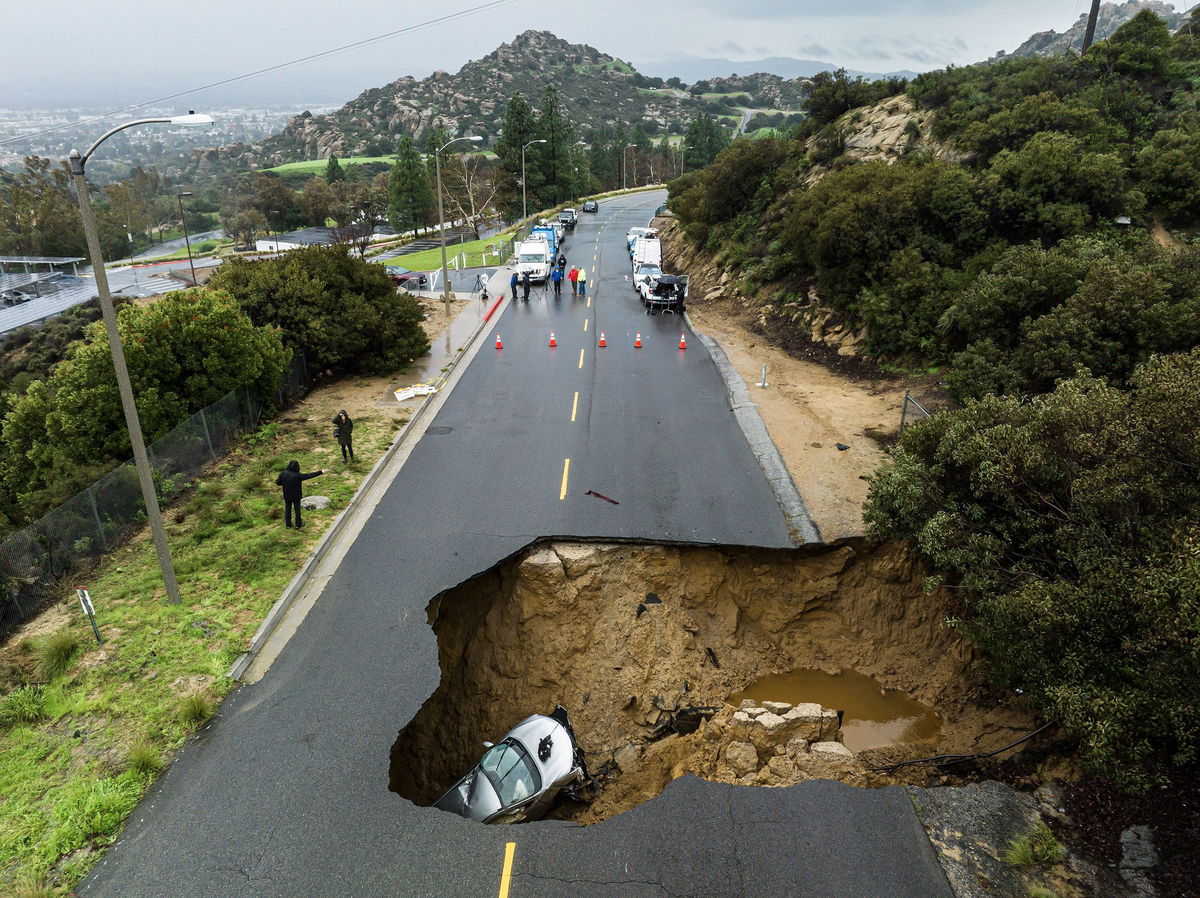 <i>Ted Soqui/Sipa/AP</i><br/>A large sinkhole opened up on a road in the Chatsworth area of Los Angeles in January