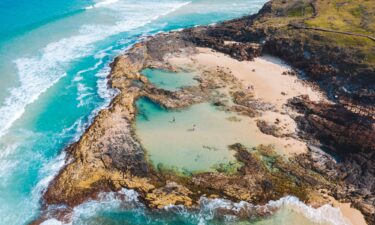 The island's famous Champagne Pools decorate its 75-mile beach.