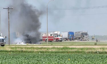 First responders are pictured following the deadly road accident near Carberry