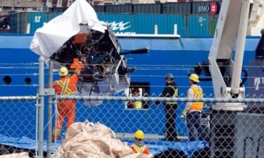 Titan debris brought up from the ocean floor is unloaded Wednesday from the Horizon Arctic ship at the Canadian Coast Guard pier in St. John's.