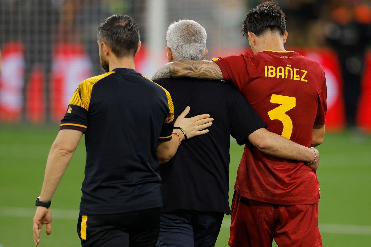 <i>Odd Andersen/AFP/Getty Images</i><br/>Jose Mourinho (middle) embraces Roma defender Roger Ibañez (right) at the end of the Europa League final.