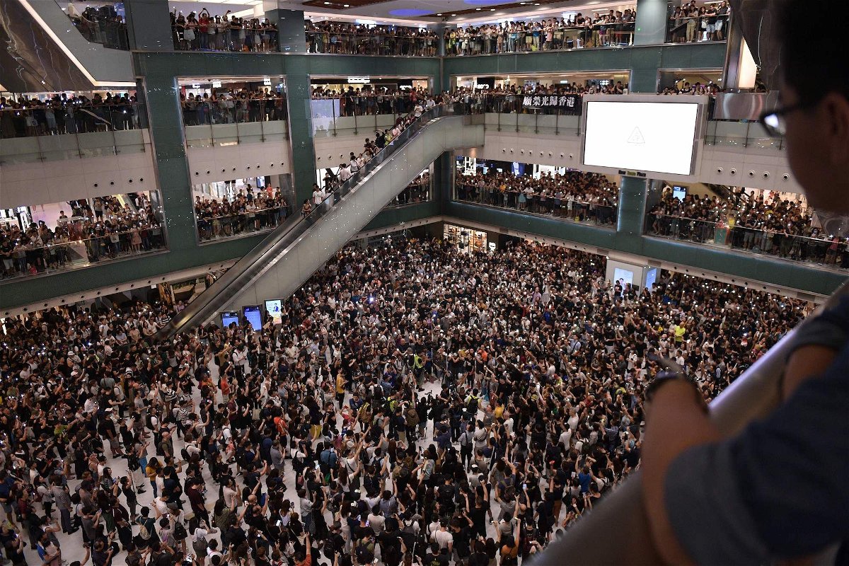 <i>Nicolas Asfouri/AFP/Getty Images</i><br/>Crowds sing the unofficial protest anthem in a shopping mall in Sha Tin