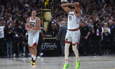 Bruce Brown and Aaron Gordon of the Denver Nuggets celebrate after a 94-89 victory against the Miami Heat in Game Five of the 2023 NBA Finals.