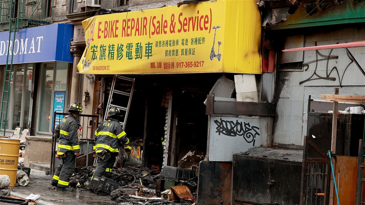 <i>Luiz C. Ribeiro/New York Daily News/Tribune News Service/Getty Images</i><br/>The charred remains of the e-bike repair and sales store in the Chinatown area of Manhattan early Tuesday.