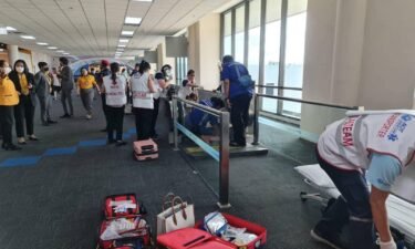 A medical team is deployed to save a woman after her leg gets caught in a moving walkway at Don Mueang International Airport.