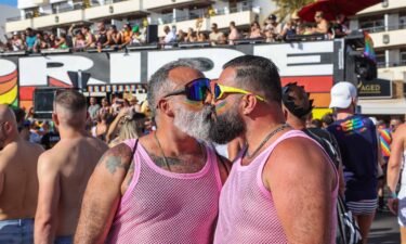 Two men kiss during the Gay Pride Maspalomas 2023