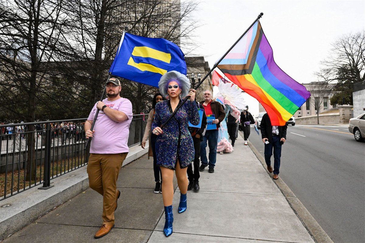<i>John Amis/Images for Human Rights Campaign/AP</i><br/>LGBTQ activists march past the Tennessee State Capitol in Nashville in February.
