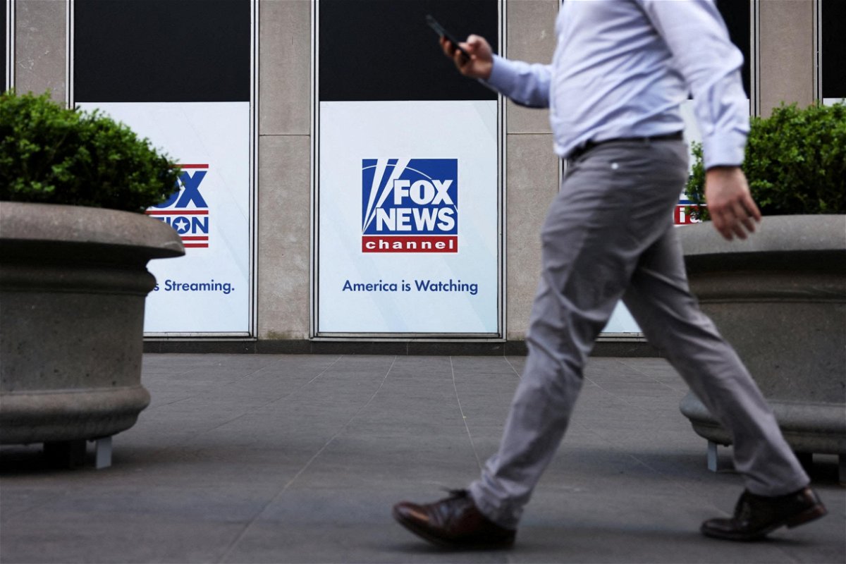 <i>Andrew Kelly/Reuters</i><br/>A person walks by Fox News signage posted on the News Corporation building in New York City