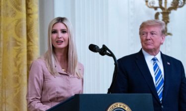 Former President Donald Trump (right) watches his daughter Ivanka Trump