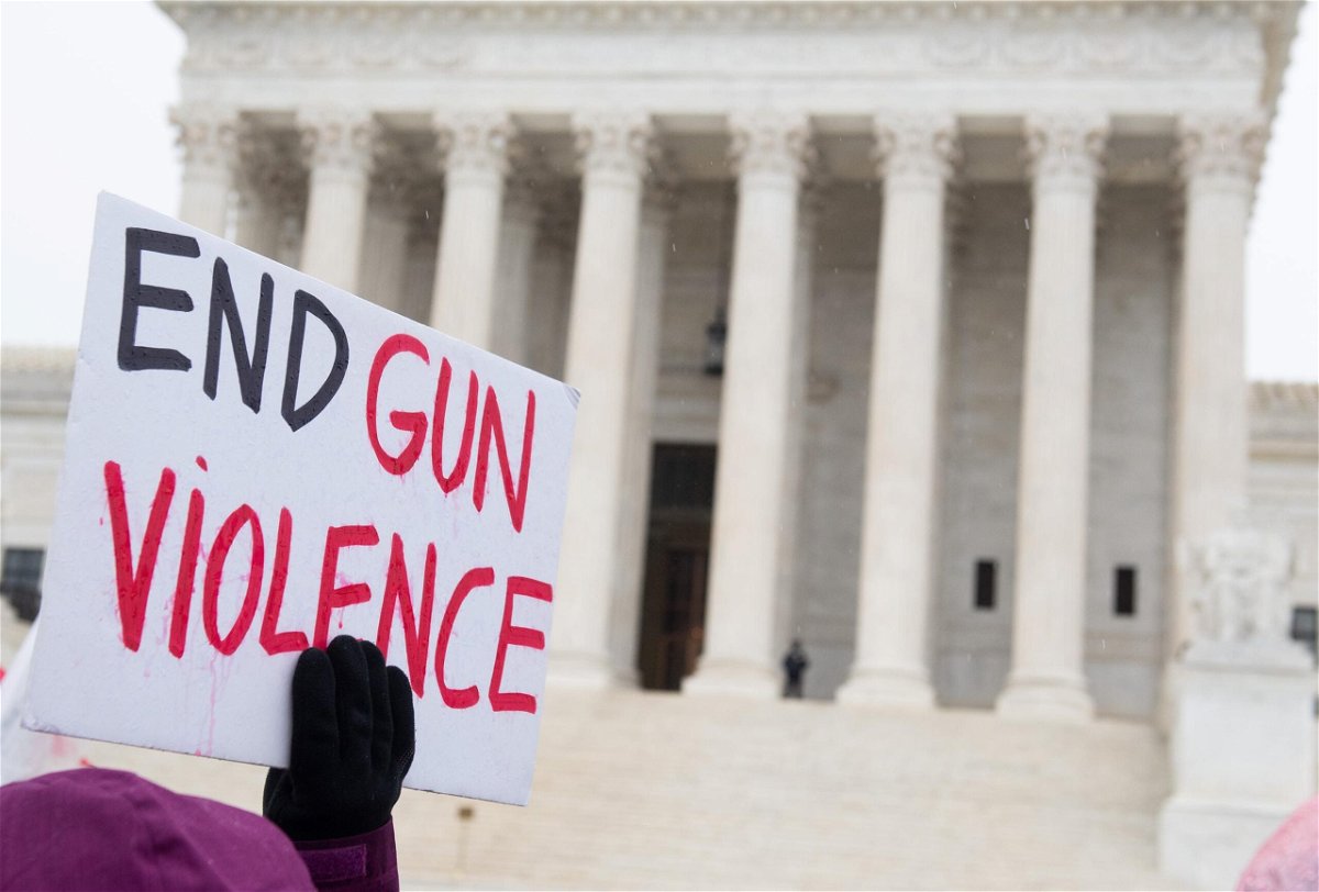 <i>SAUL LOEB/AFP/Getty Images</i><br/>Supporters of gun control and firearm safety measures hold a protest rally outside the US Supreme Court in December 2019.