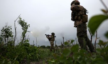 Ukrainian soldiers of the 28th Separate Mechanized Brigade fire a grenade launcher at the front line near the town of Bakhmut