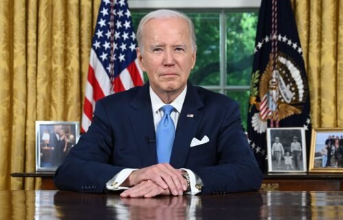President Joe Biden sits in the Oval Office ahead of addressing the nation on averting default and the Bipartisan Budget Agreement