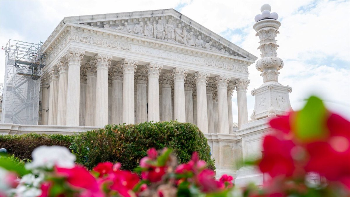 <i>Jacquelyn Martin/AP</i><br/>The Supreme Court is seen behind flowers on June 27 in Washington