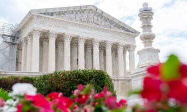 The Supreme Court is seen behind flowers on June 27 in Washington