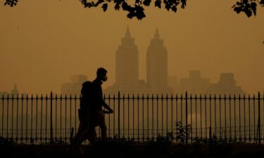 People walk in Central Park on June 7.